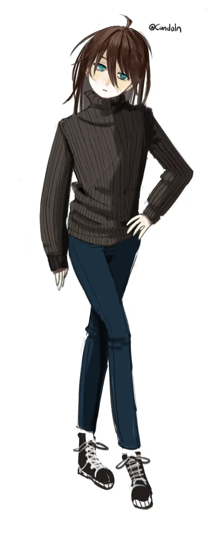 A standing position of Schden who is wearing a sweater and jeans.
